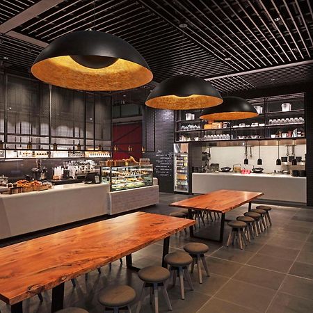 Готель Park Hyatt Окленд Екстер'єр фото The interior of a Starbucks Reserve store in Shanghai, China